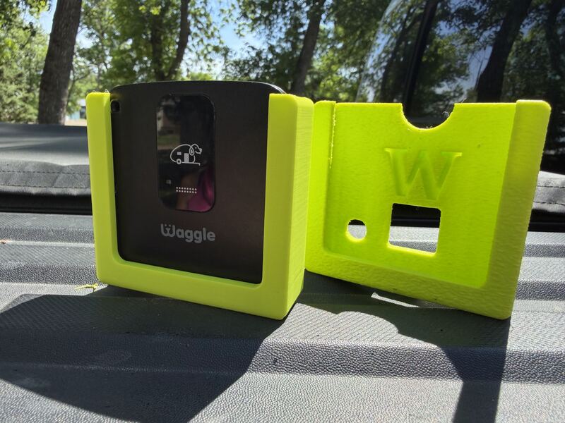 Pink 3D printed Waggle kennel mount with a W cut into the front panel.